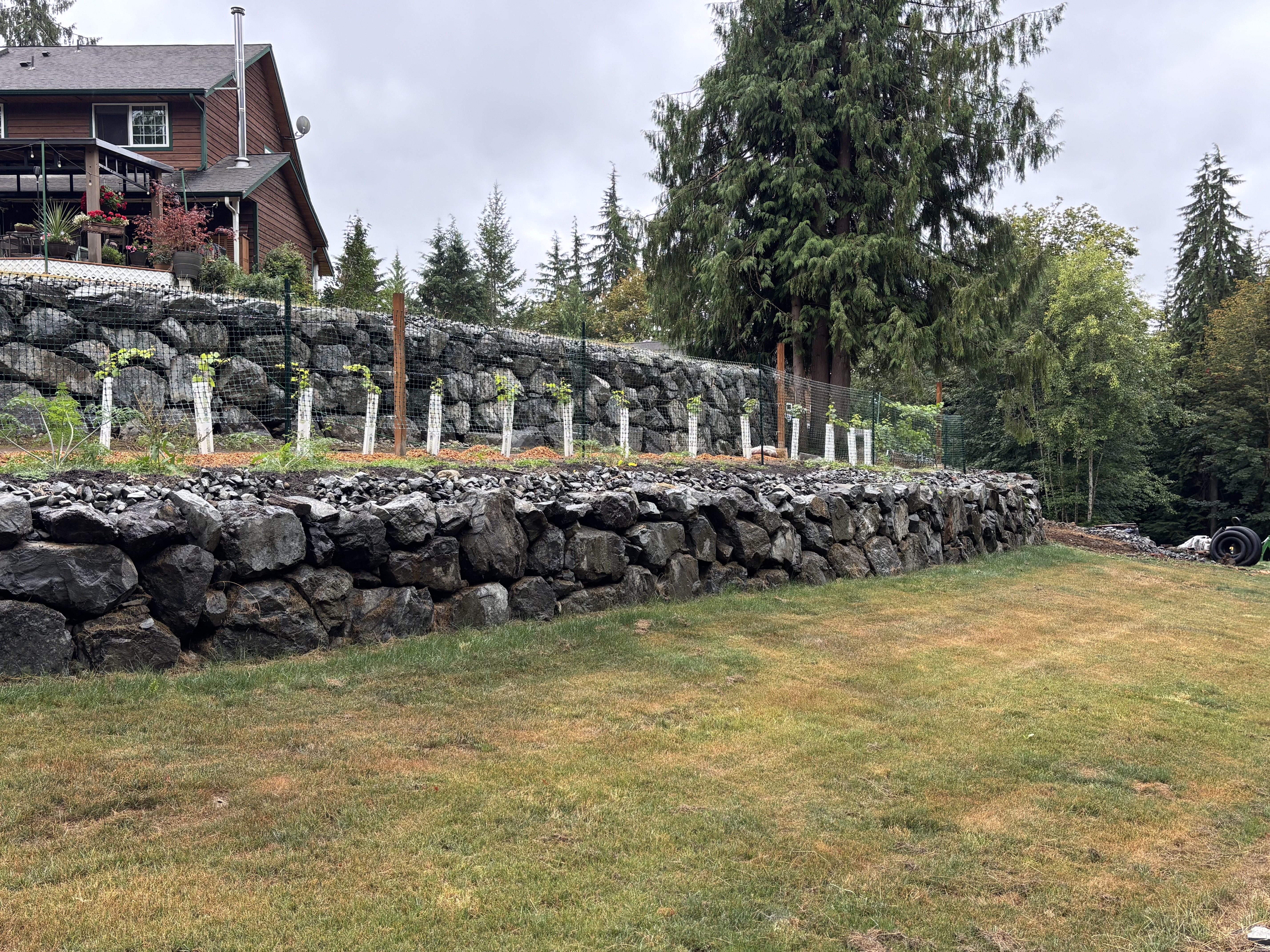 After photo showing completed retaining wall and cleaned property